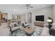Open concept living space with kitchen, dining and living room area and ceiling fan at 13473 N 158Th Ave, Surprise, AZ 85379