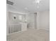 Spacious upstairs loft area with neutral walls, carpet, natural light and a modern railing at 13473 N 158Th Ave, Surprise, AZ 85379