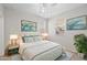 Comfortable bedroom showcasing a queen bed, stylish decor, and a cozy rug on plush carpet at 13473 N 158Th Ave, Surprise, AZ 85379