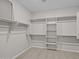 Spacious walk-in closet featuring extensive shelving and hanging rods for ample storage at 13473 N 158Th Ave, Surprise, AZ 85379