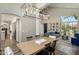Dining area with modern light fixture and views into the living room at 14545 N 99Th St, Scottsdale, AZ 85260