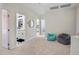 Spacious hallway leading to bedrooms and a bathroom; features neutral carpeting and views of the home's interior at 14545 N 99Th St, Scottsdale, AZ 85260