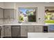 Bright kitchen with modern appliances and white quartz countertops at 14545 N 99Th St, Scottsdale, AZ 85260
