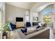Bright living room featuring modern furniture and open dining area at 14545 N 99Th St, Scottsdale, AZ 85260