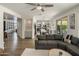 Open-concept living room showcasing the kitchen and dining areas with a neutral color palette and modern finishes at 14545 N 99Th St, Scottsdale, AZ 85260
