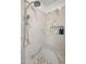 Shower featuring marble-look tile, a built-in bench and niche, and a modern shower head at 14545 N 99Th St, Scottsdale, AZ 85260