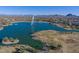 Stunning aerial view of a desert community with a large lake and fountain surrounded by mountains at 15045 E Sundown Dr, Fountain Hills, AZ 85268