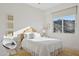 Bright bedroom with a comfortable bed, stylish decor, and a window showcasing mountain views at 15045 E Sundown Dr, Fountain Hills, AZ 85268