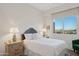 Cozy bedroom featuring a soft bed, bedside tables with lamps, and a scenic outdoor view at 15045 E Sundown Dr, Fountain Hills, AZ 85268