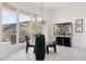 Elegant dining room with a glass table, modern light fixture, and stunning outdoor views at 15045 E Sundown Dr, Fountain Hills, AZ 85268