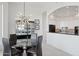Dining area features a modern light fixture and a glass table at 15045 E Sundown Dr, Fountain Hills, AZ 85268