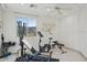 Bright, airy exercise room with weights, bench, and stationary bike with mountain view at 15045 E Sundown Dr, Fountain Hills, AZ 85268