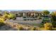Exterior elevation of the home with manicured landscaping at 15045 E Sundown Dr, Fountain Hills, AZ 85268