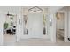 Bright foyer with elegant finishes, including tile floors, modern lighting, and sleek doors at 15045 E Sundown Dr, Fountain Hills, AZ 85268