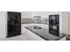 Kitchen featuring white cabinets, black countertops and black stainless steel appliances at 15045 E Sundown Dr, Fountain Hills, AZ 85268