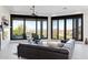 Bright living room with large windows, mountain view and a dark, comfortable sectional sofa at 15045 E Sundown Dr, Fountain Hills, AZ 85268