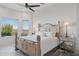 Inviting main bedroom with a large bed, mirrored nightstands, and a picturesque mountain view at 15045 E Sundown Dr, Fountain Hills, AZ 85268