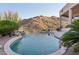Stunning pool with rock waterfall feature and desert landscape at 15045 E Sundown Dr, Fountain Hills, AZ 85268