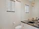 Stylish powder room with granite countertop, modern fixtures, and neutral walls at 15045 E Sundown Dr, Fountain Hills, AZ 85268
