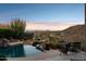 Enjoy the sunset from the pool of this beautiful property overlooking the mountains and desert landscape at 15045 E Sundown Dr, Fountain Hills, AZ 85268