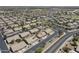 Expansive aerial view of a well-planned community featuring desert landscaping and solar panels at 1518 E 12Th St, Casa Grande, AZ 85122