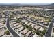 Wide aerial view showcasing a residential community with green spaces and neatly arranged homes at 1518 E 12Th St, Casa Grande, AZ 85122