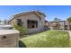 Backyard featuring manicured artificial grass, a gazebo with outdoor dining and a beautiful private pool at 1518 E 12Th St, Casa Grande, AZ 85122