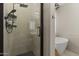 This bathroom features a glass shower with matte black hardware and a view of the standalone soaking tub at 1518 E 12Th St, Casa Grande, AZ 85122