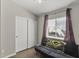 This neutral bedroom boasts wood-look floors, a large closet, and a ceiling fan at 1518 E 12Th St, Casa Grande, AZ 85122