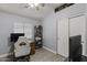 This bedroom provides a bright, neutral space with recessed lighting and wood look floors at 1518 E 12Th St, Casa Grande, AZ 85122