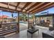 Relaxing covered patio with an outdoor bar and lounge area, perfect for enjoying the backyard pool and sunshine at 1518 E 12Th St, Casa Grande, AZ 85122