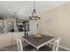 Cozy dining area with modern light fixture adjacent to the kitchen at 1518 E 12Th St, Casa Grande, AZ 85122