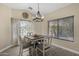 Comfortable dining area featuring a stylish light fixture and natural light at 1518 E 12Th St, Casa Grande, AZ 85122