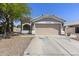 Attractive house with a two-car garage, traditional architectural details, and easy access via the concrete driveway at 1518 E 12Th St, Casa Grande, AZ 85122