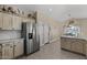 Stylish kitchen with stainless steel appliances and light-colored cabinets at 1518 E 12Th St, Casa Grande, AZ 85122