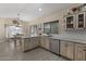 Charming kitchen with granite counters, stainless appliances, and a dining nook at 1518 E 12Th St, Casa Grande, AZ 85122