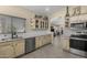 Elegant kitchen featuring stainless steel appliances, granite counters, and custom cabinets at 1518 E 12Th St, Casa Grande, AZ 85122