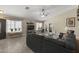 Inviting living room featuring tile floors, comfortable seating, stylish decor, and ample natural light at 1518 E 12Th St, Casa Grande, AZ 85122