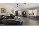 Cozy living room features a comfortable sofa, ceiling fan, and wood-look tile flooring at 1518 E 12Th St, Casa Grande, AZ 85122