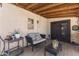 Covered patio features string lights, furniture and view of the backyard at 1518 E 12Th St, Casa Grande, AZ 85122