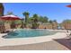 Beautiful in-ground pool featuring a surrounding patio, palm trees, and ample space for outdoor lounging and entertaining at 1518 E 12Th St, Casa Grande, AZ 85122