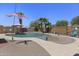 Inviting in-ground pool with palm trees, patio, and recreational features for relaxation and outdoor enjoyment at 1518 E 12Th St, Casa Grande, AZ 85122