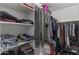 Organized walk-in closet with shelving and hanging rods offering plenty of room for clothes and accessories at 1518 E 12Th St, Casa Grande, AZ 85122