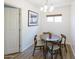 Cozy dining area featuring a modern table set, wood-look floors, and a stylish chandelier at 1546 W Pierce St, Phoenix, AZ 85007