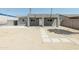Charming single-story home featuring a minimalist front yard, gray stucco, and a welcoming entrance at 1546 W Pierce St, Phoenix, AZ 85007