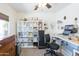 Organized office featuring shelving, a desk setup, and comfortable seating for a productive workspace at 1546 W Pierce St, Phoenix, AZ 85007