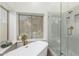 Luxurious bathroom with a soaking tub, glass shower, and stylish fixtures at 1591 S Sycamore Pl, Chandler, AZ 85286