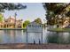 Scenic community lake view, showcasing waterfront homes and lush landscaping in a peaceful setting at 1591 S Sycamore Pl, Chandler, AZ 85286
