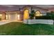 Charming home featuring a tile roof, manicured lawn, and an attached two-car garage at 1591 S Sycamore Pl, Chandler, AZ 85286