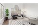 Bright living room featuring modern furniture, a large window, and stylish decor at 1591 S Sycamore Pl, Chandler, AZ 85286